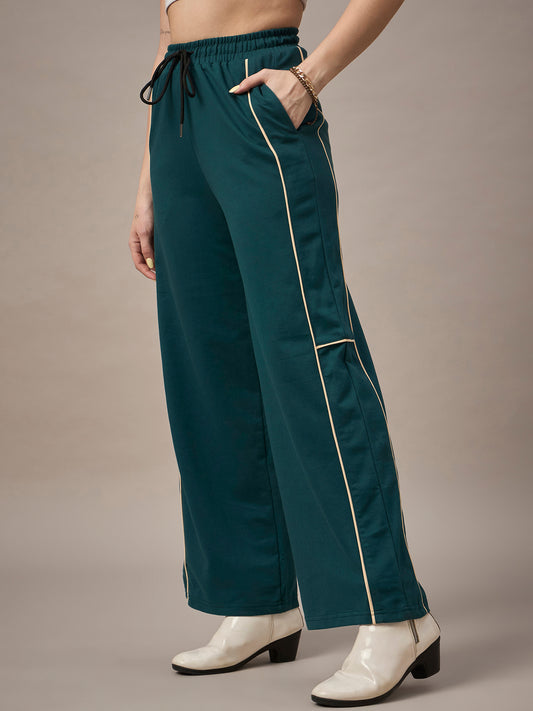 Close-up of fabric and drawcord waistband on teal womenÃ¢â‚¬â„¢s track pants