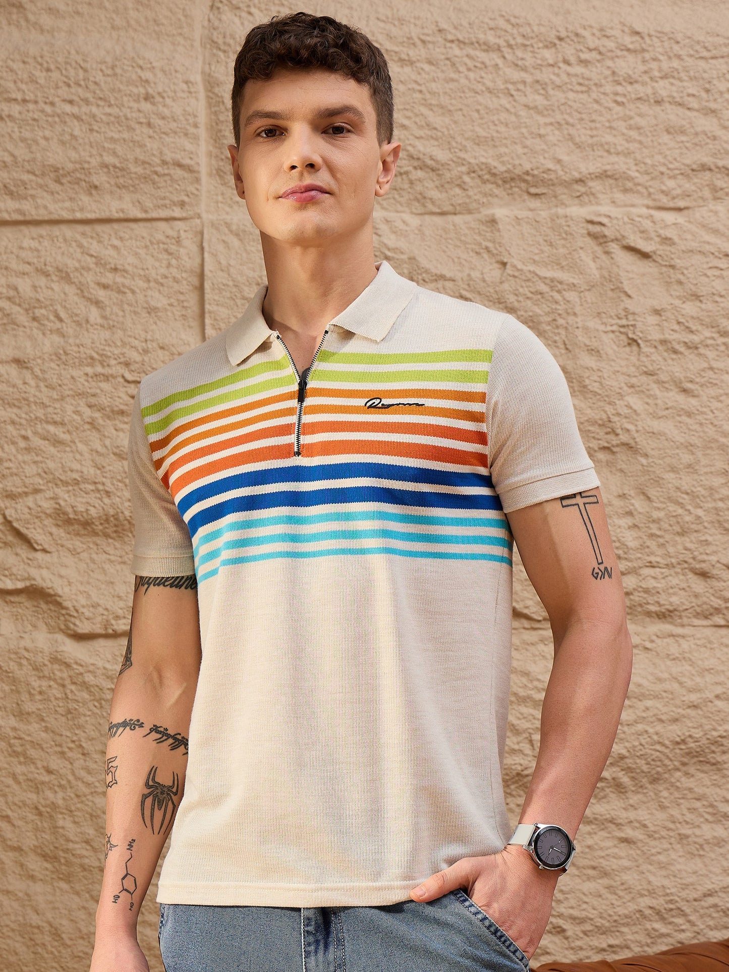Close-up of cotton piqué texture and ribbed collar on beige striped polo