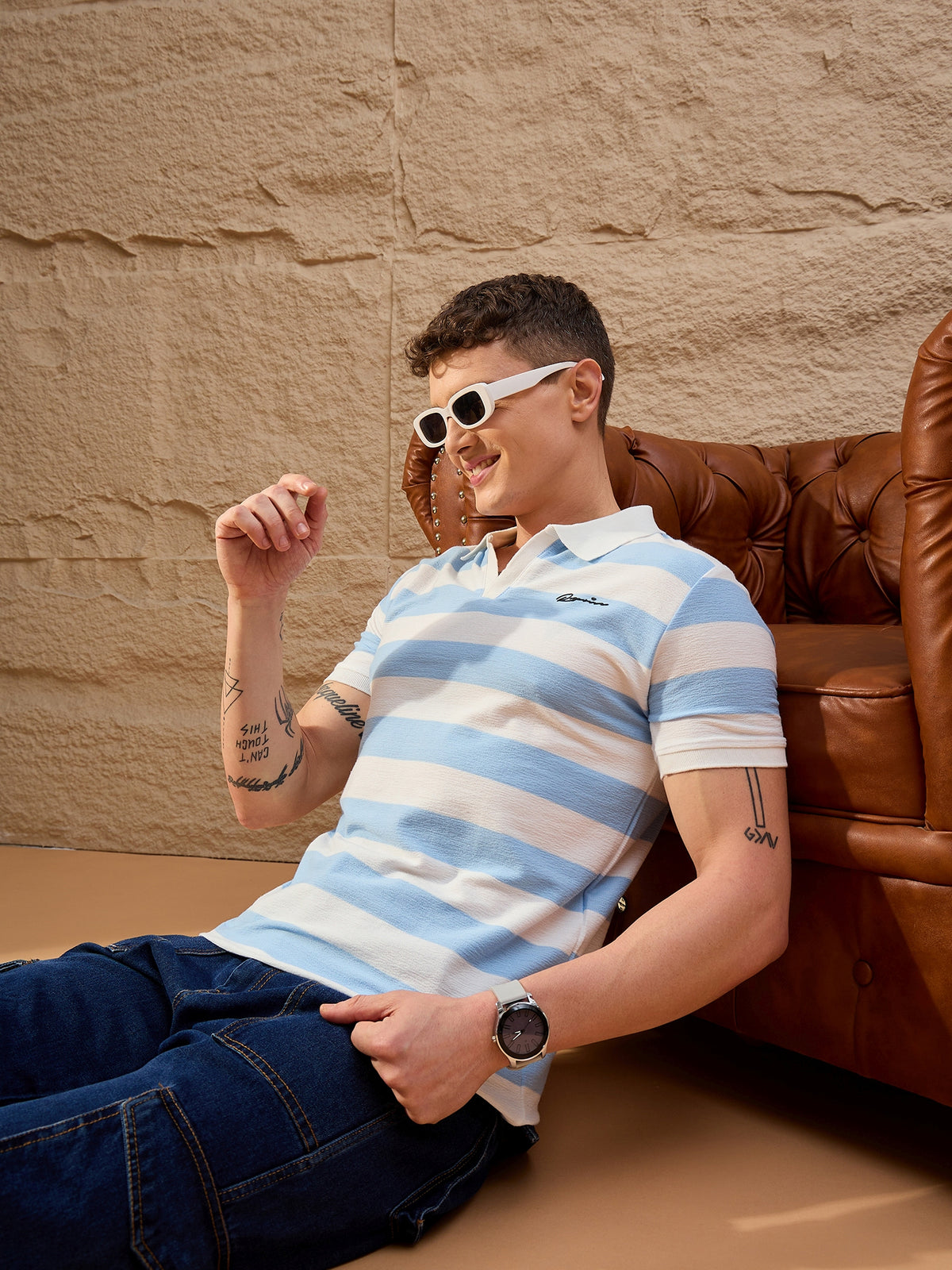 Close-up of cotton piqué texture and ribbed collar on white & powder blue striped polo